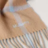 Merinowollschal mit kleinem Karomuster in Camel & Poplinblau Merinowollschal mit kleinem Karomuster in Camel & Poplinblau