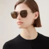 Rosie Sonnenbrille aus Gold- und braunem Metall mit Bio-Nylon-Gläsern Rosie Sonnenbrille aus Gold- und braunem Metall mit Bio-Nylon-Gläsern