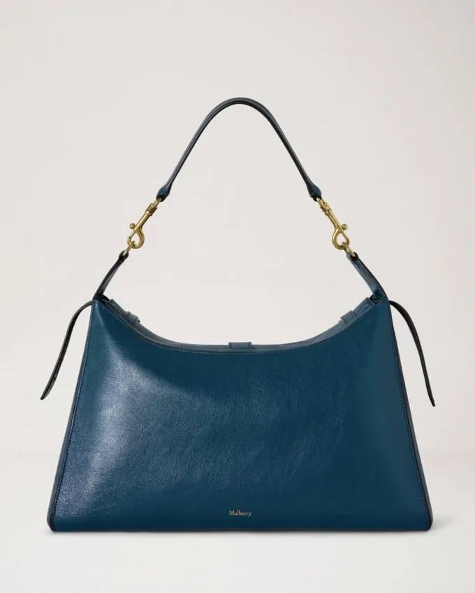 Roxanne-Umhängetasche aus blauem Hochglanzleder Roxanne-Umhängetasche aus blauem Hochglanzleder