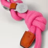 Seil-Schlüsselanhänger aus dunkelrosa und korallenorangefarbenem Material Seil-Schlüsselanhänger aus dunkelrosa und korallenorangefarbenem Material
